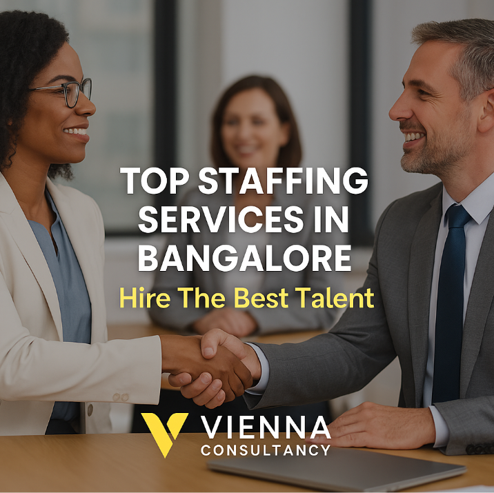 Business professionals shaking hands representing top staffing services in Bangalore by Vienna Consultancy.